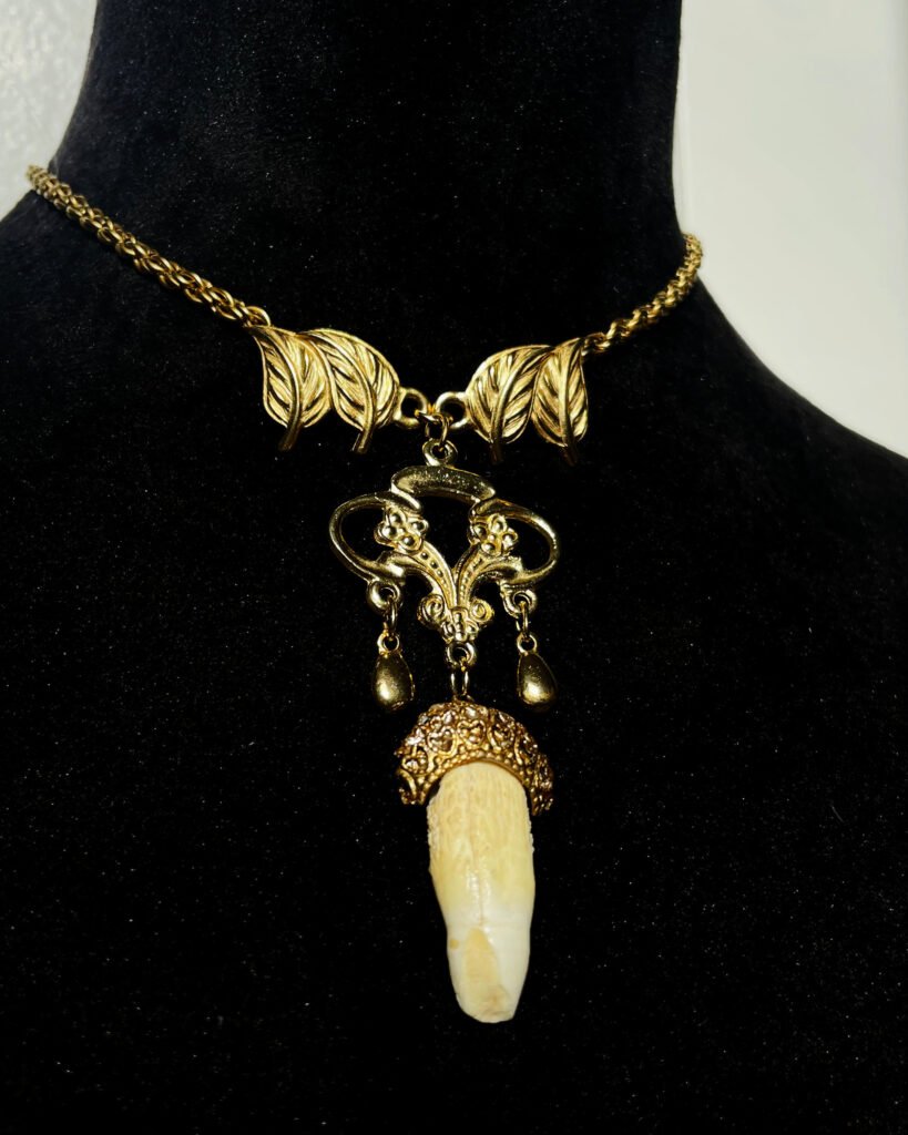 Alligator tooth: Inspired by Baroque jewelry, this necklace is made from two earrings, a broken pendant and an alligator tooth I got when I was 9.